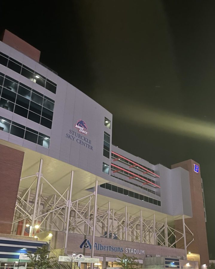 The Boise State stadium shines at night. 
