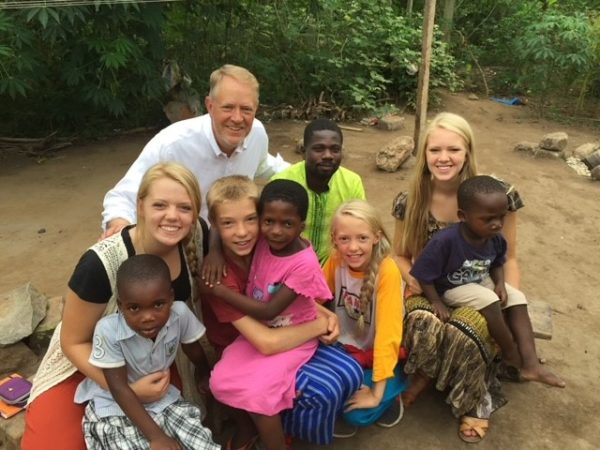 Travelling through the program Ghana Make a Difference, senior Molly Johnson and her family pose for a picture with Ghanaian children. The program helps improve education, provide shelter, and fight against human trafficking in Ghana. 