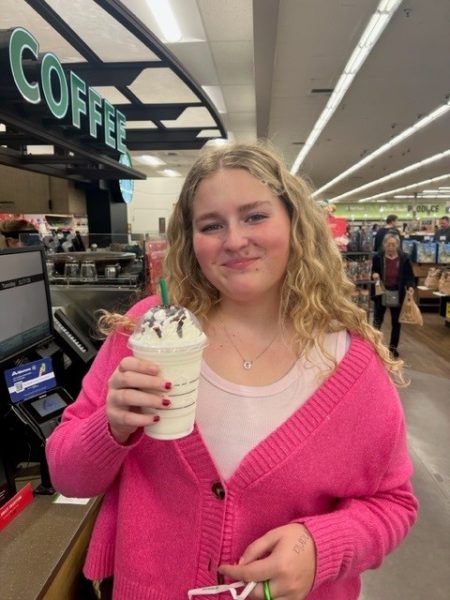 Senior Ellektra Klein poses with her Starbucks holiday drink of choice at the Eagle Albertson’s location. 