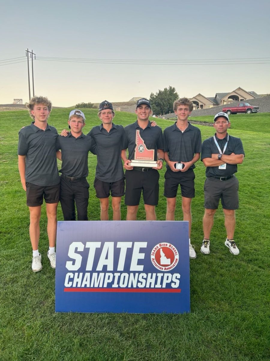 The Eagle High golf team receives second place in the state championships tournament. Senior Beau Sahr holds the red second place trophy. 