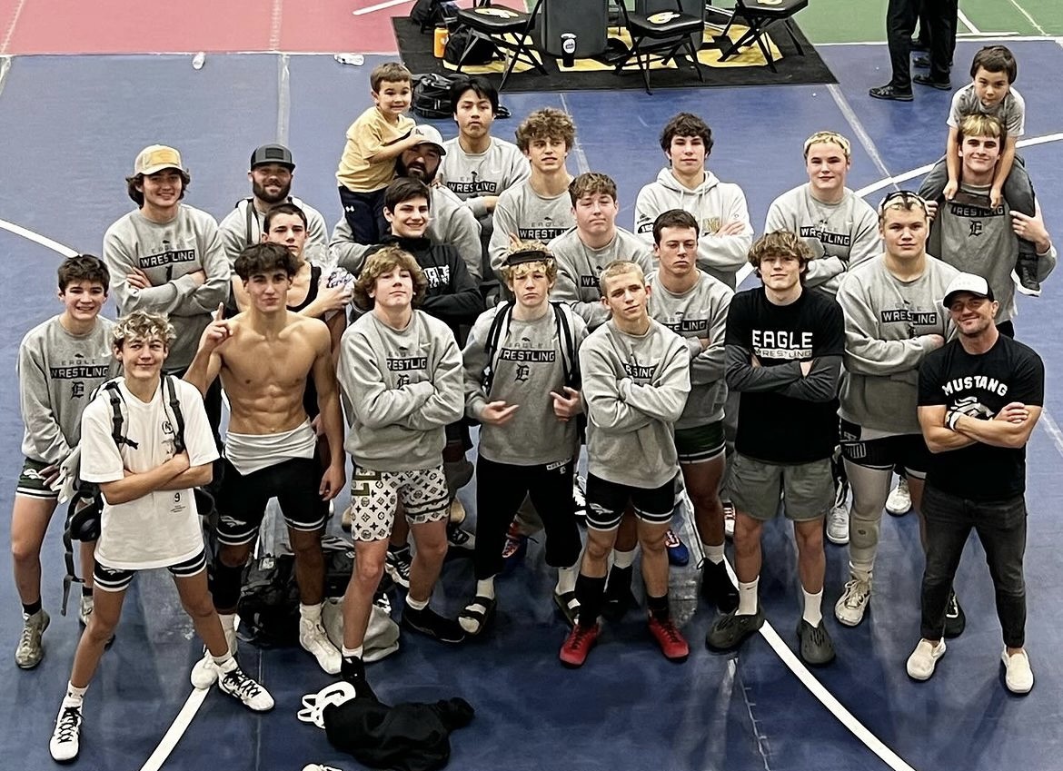 The Eagle High boys wrestling team celebrates their win in the Donney Duals silver bracket.  Sophomore Dylan Frothinger, senior Wylie Stone, senior Sebastian Delgado and junior Anthoney Toomey stand undefeated by the end of the day. 