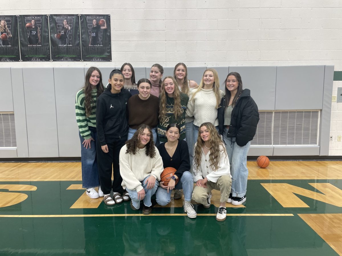 Eagle High girls’ varsity stands on the court hours prior to their Senior Night game. They go through a walkthrough of the gameplan which lead to a to win that evening. 