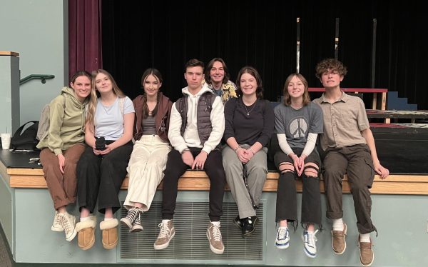 The Yellow Boat cast sits on the Eagle High stage for a cast photo after a successful day of rehearsing their upcoming play. This is the cast from left to right: Junior Marin Weaver, sophomore Ally Godfrey, sophomore Taylor Milliot, senior Jack Windsor, senior Bradley Fischer, junior Lauren Avery, freshman Katiana Lovitt and junior Cole McAdams.