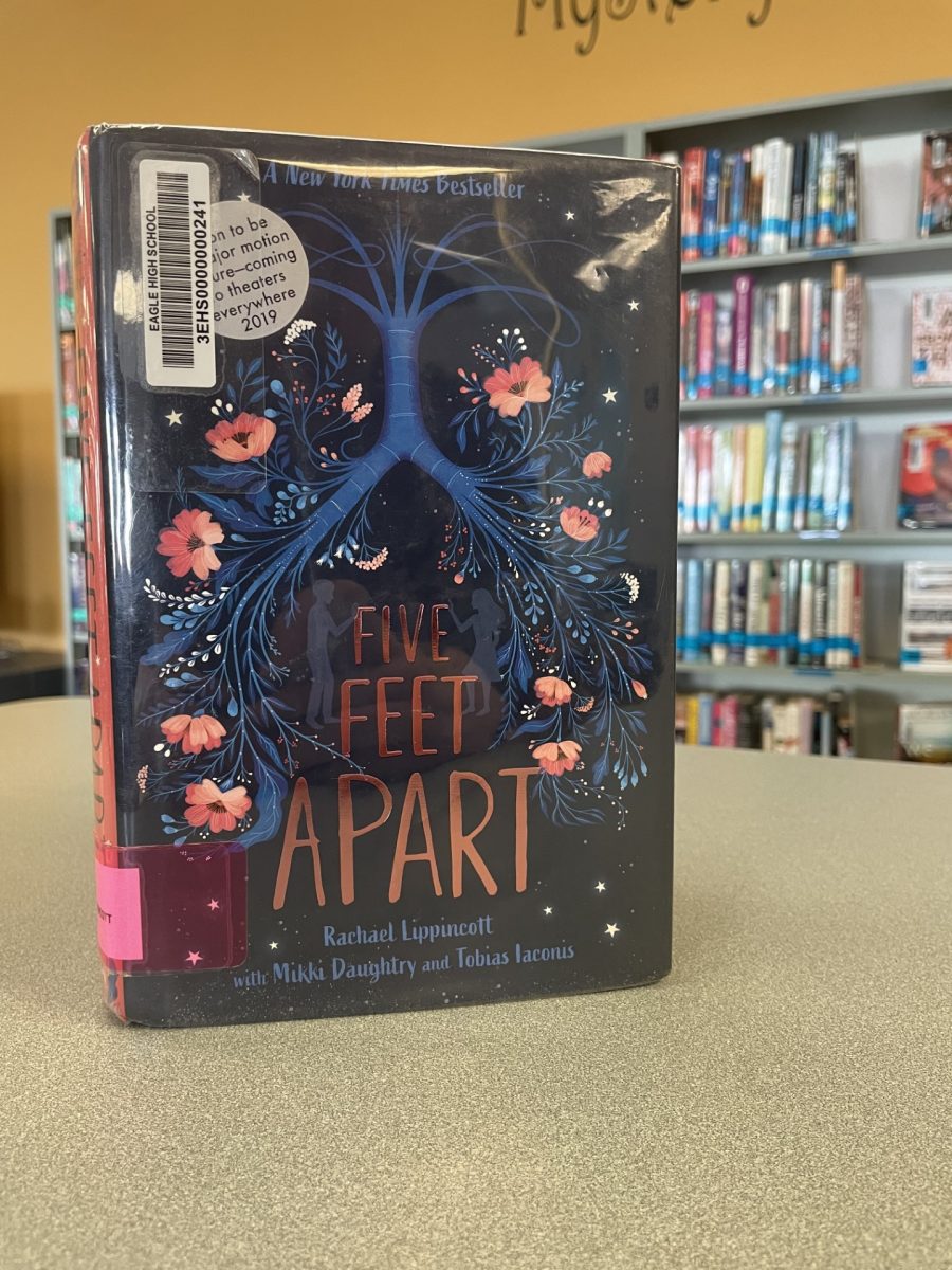 A book titled “Five Feet Apart” is located in the Eagle High School library. The book was written by Rachael Lippincott.  