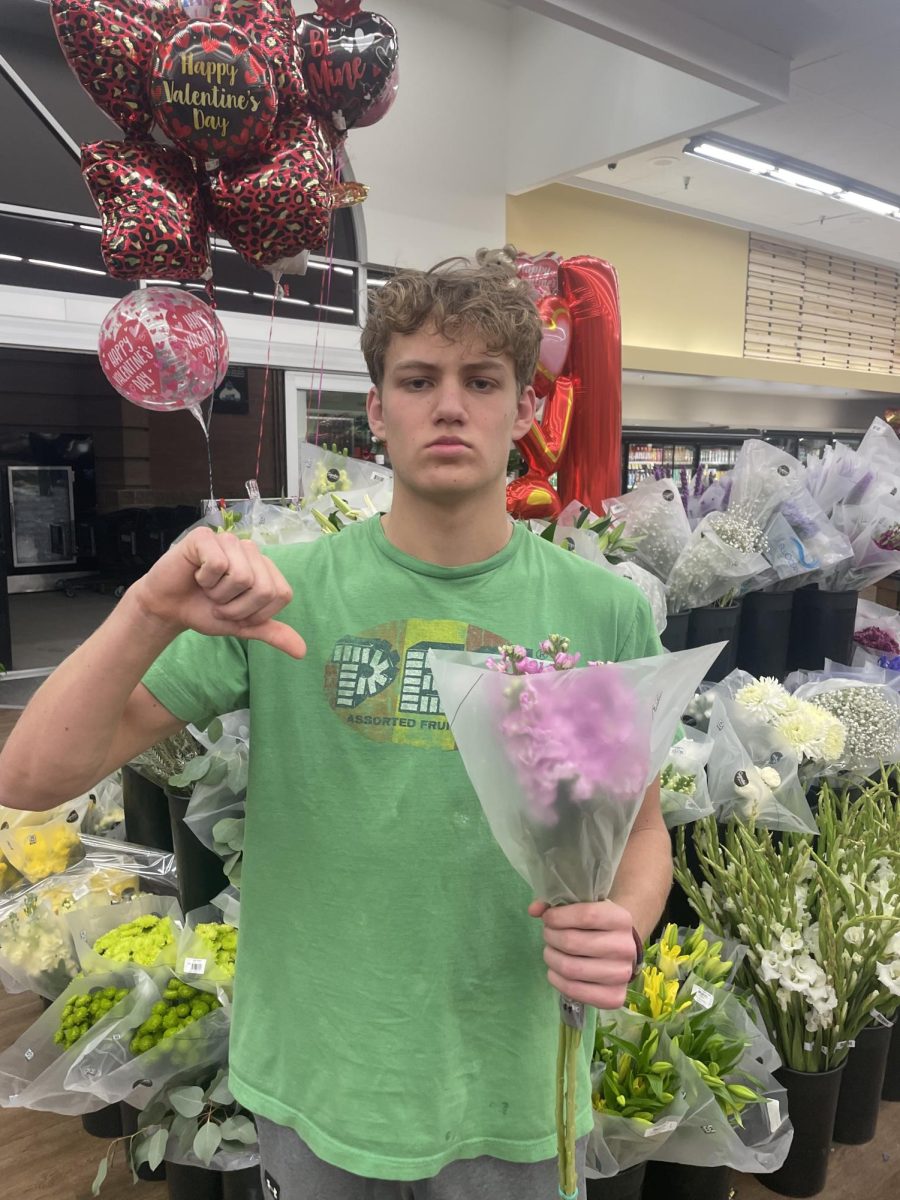 Eagle High junior Grant Cardwell is shopping for flowers on Valentine’s Day. Many kids like Cardwell think Valentines Day is overrated.