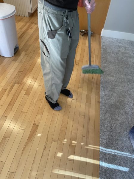 Eagle High freshman Johnny Culpepper sweeps the floor. He is getting the house cleaned up for spring. 