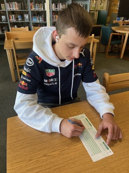 Sophomore Gavin Hansen fills out a Scantron test, a popular tool used for quick and easy grading for standardized tests. Standardized testing has been a means of assessing students’ academic abilities in the U.S. for many years.  
