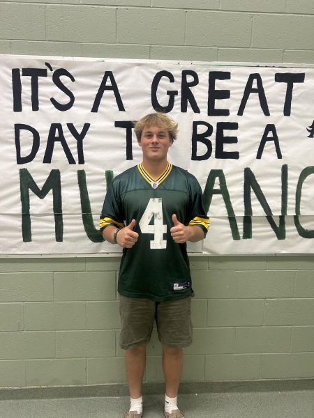 Senior Cole Brooks shows support for the international football game in Brazil. The Jersey in the photo is Brett Favre’s, a former player for the Green Bay Packers, the team that will play the Philadelphia Eagles in Brazil. 