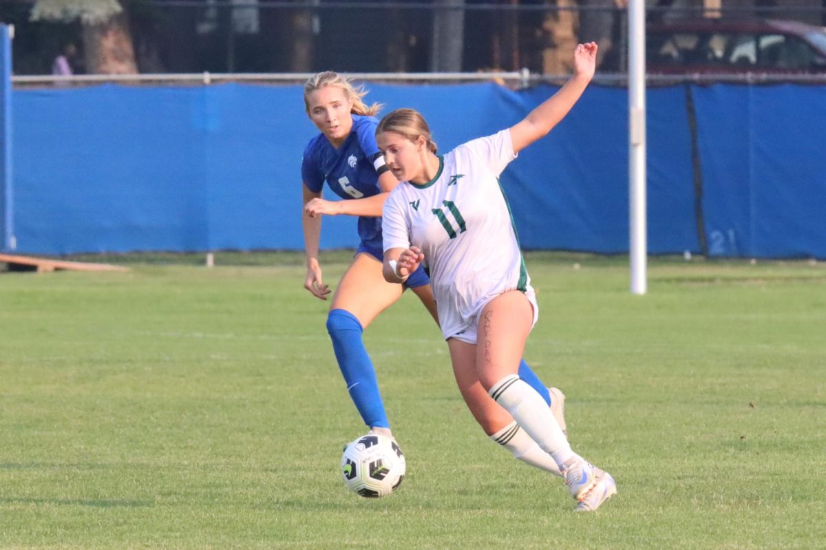 Freshman Stella Jones takes the ball from a defender and drives to the goal in a game against Timberline High. Later in the game, she scores a goal but will be taken out due to a concussion. 