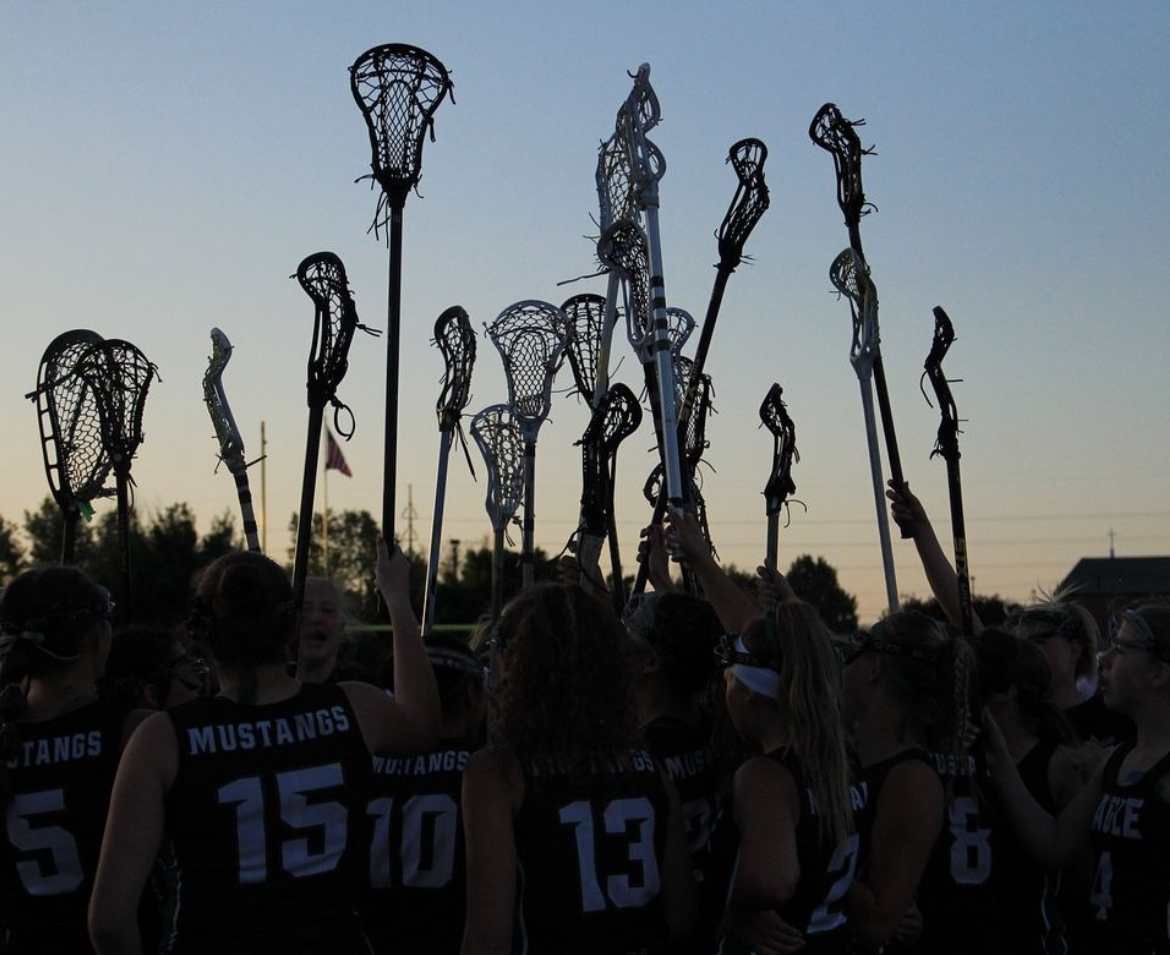 Last season, the Eagle Girls’ Lacrosse Club rally together after a win. This year, they look forward to the season to come and the bonds they make while playing.