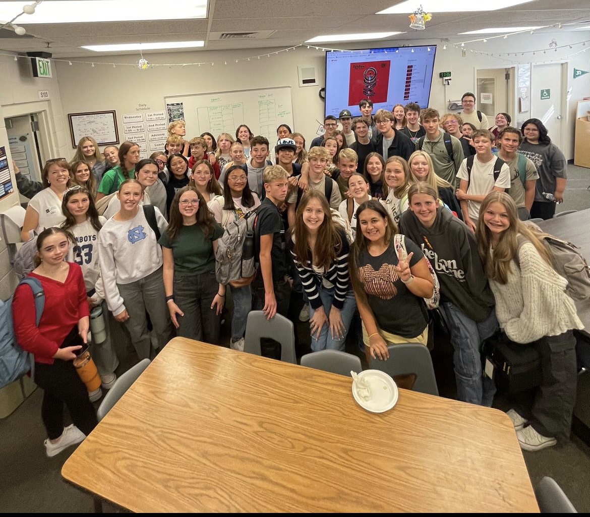 The Just Serve Club takes a group picture after their most recent service project. They were sorting jewelry for the Idaho Youth Ranch. 