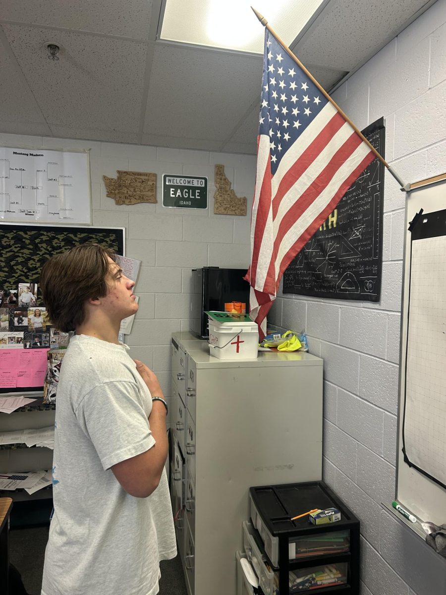 Senior Jack Giannini pledges allegiance to the flag of the United State of America. He shows his support to the many veterans by honoring the flag every day. 