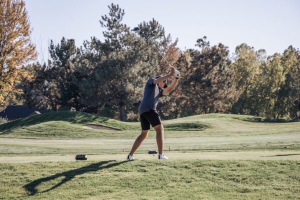 Senior Beau Sahr winds up to drive the ball off the tee in the district golf tournament. Sahr has been on the golf team at Eagle High since he was a freshman. 