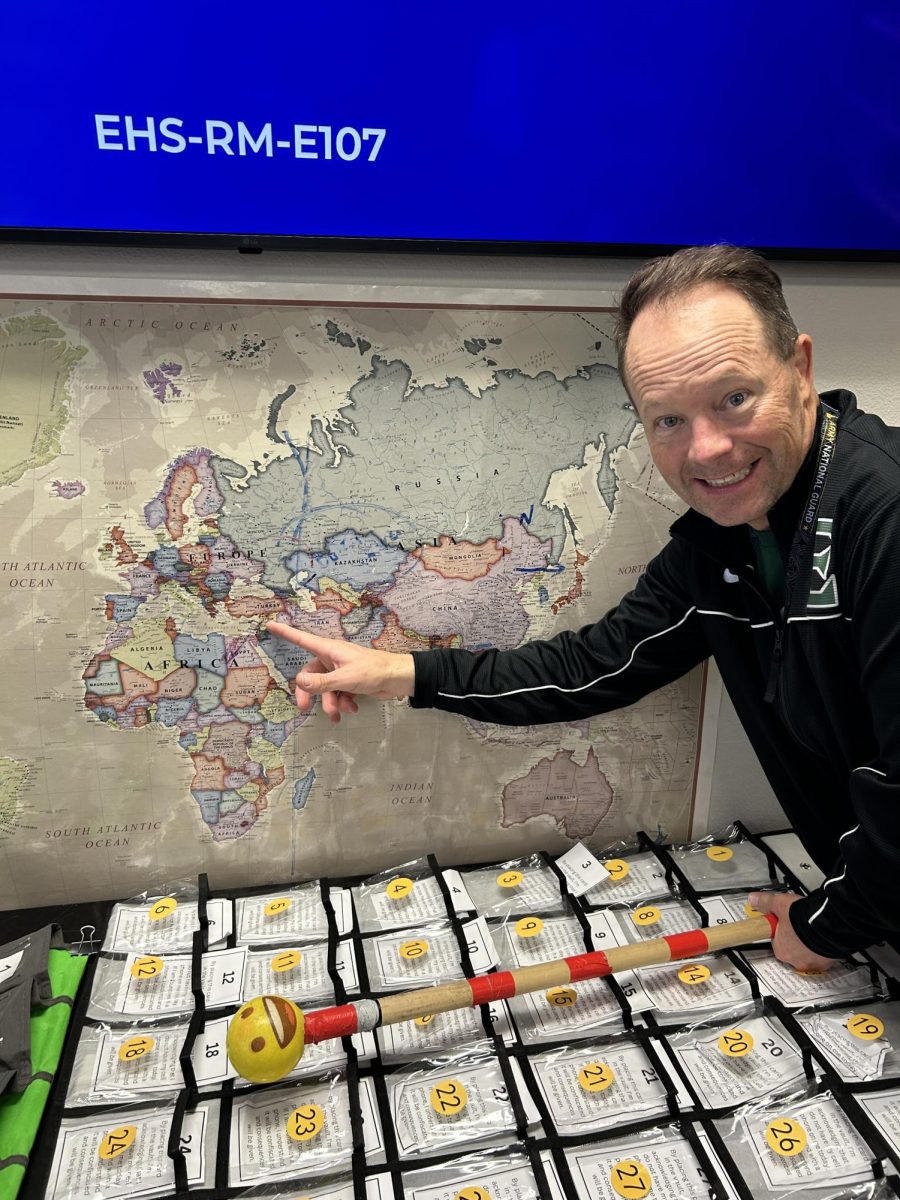 Eagle High teacher Stephen Pratt shows Iseral on a classroom map. He points to the center spot of conflict in the Iseral and Hamas war.