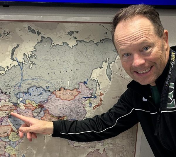 Eagle High teacher Stephen Pratt shows Israel on a classroom map. He points to the center spot of conflict in the Israel and Hamas war.