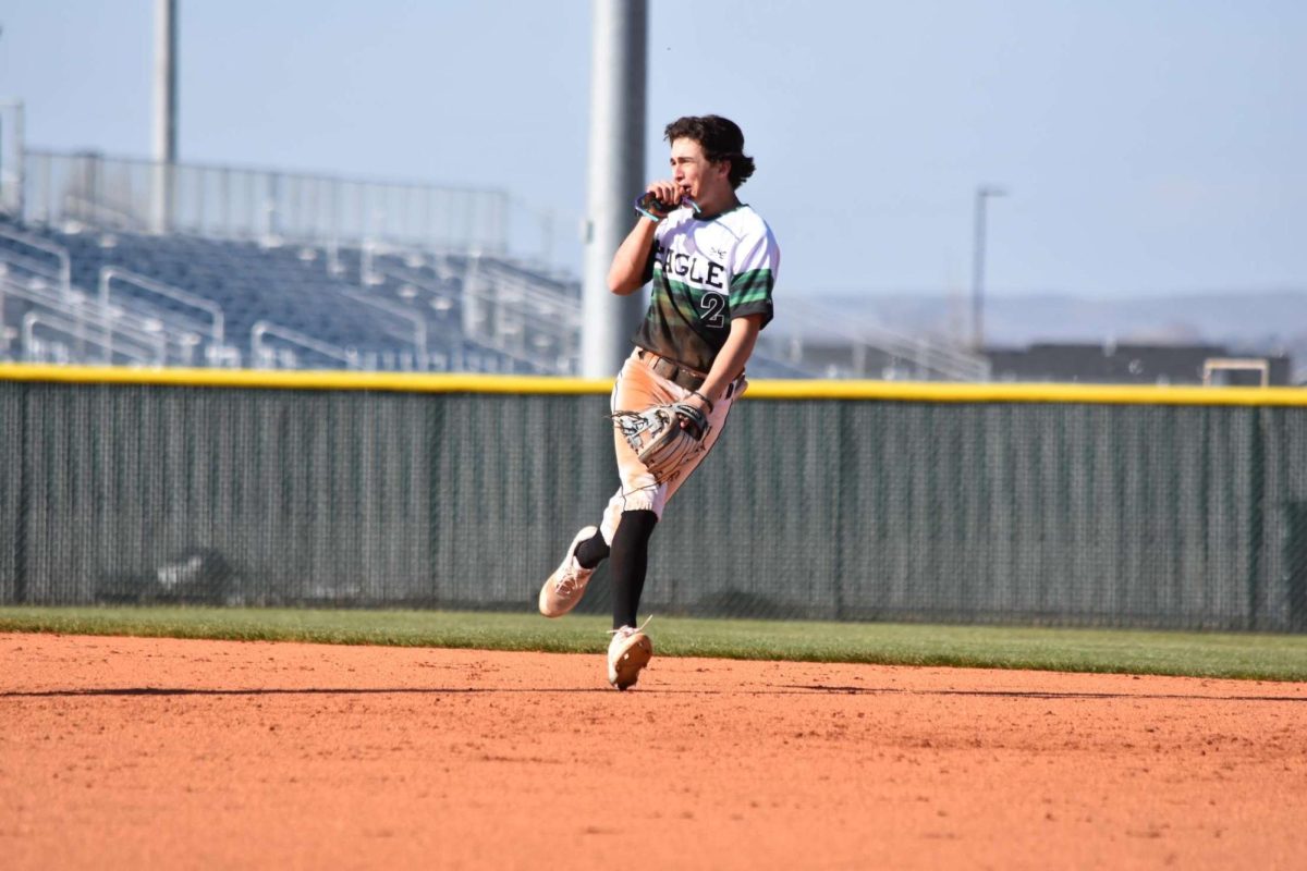 Junior Kristian Fusco makes an outstanding play from shortstop against Owyhee High. Fusco not only excels in school, but also on the baseball diamond.