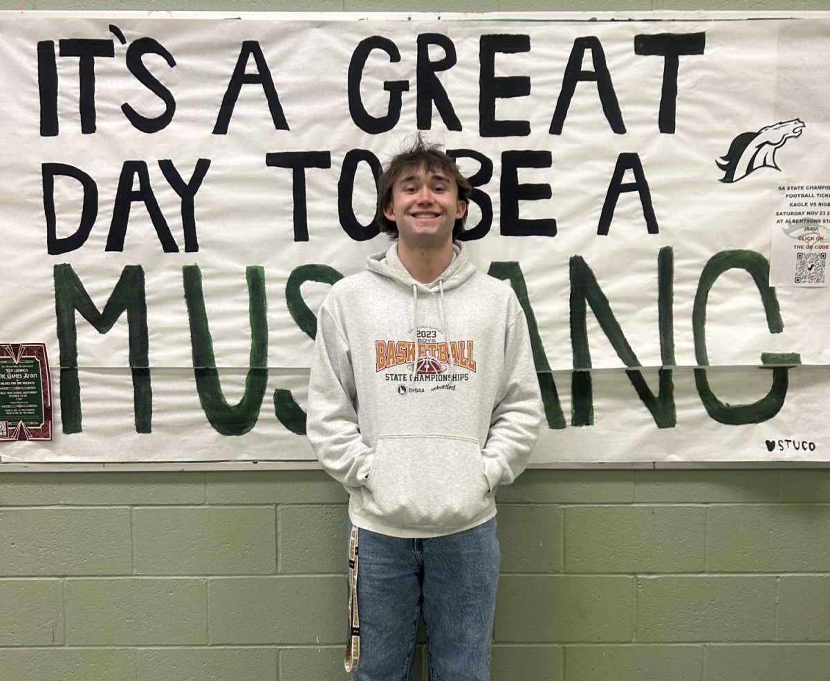 Junior Evan Vittoe poses for the camera in his State 2023 Basketball sweatshirt. Vittoe is a leader on the Eagle High basketball team as it is his third-year lettering.