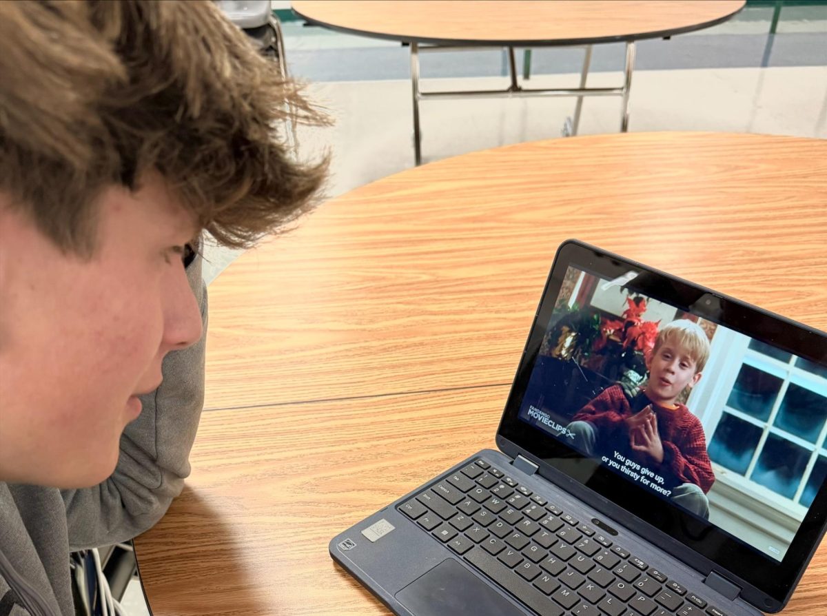 Sophomore Beau Mather watches “Home Alone” at lunchtime. This movie is one of many amazing Christmas movies that families all over watch during Christmastime. 