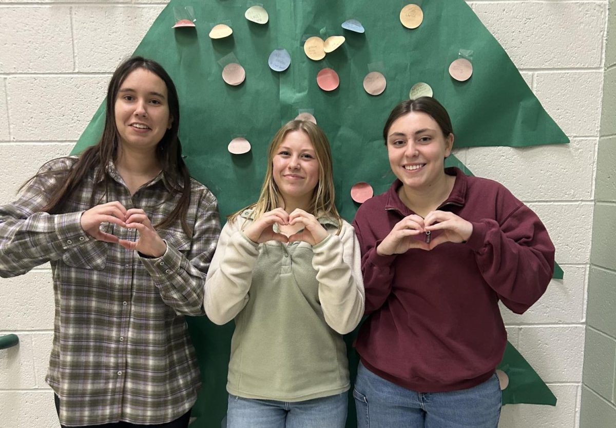 Christmastime brings exciting gifts and friends together. Seniors Gracie Boomgarden, Abbey Nadler and Camryn Hunt all enjoy the gifts they got this year, including new shoes and jewelry. 