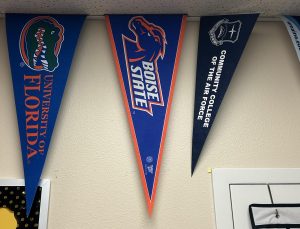 A Boise State banner hangs on the wall in support of the school. The pride from winning the Mountain West Championship is portrayed through the banner. 