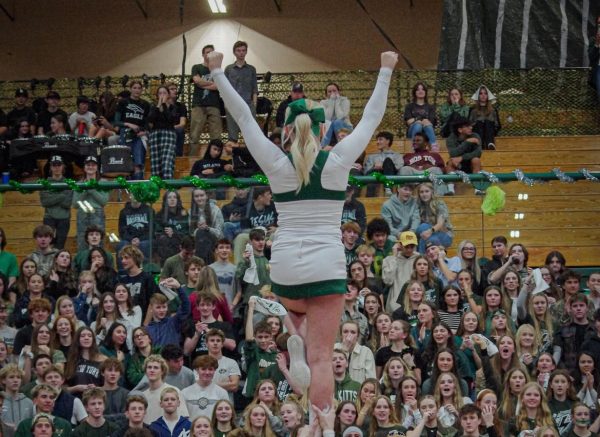 Junior Adelie Cook is held in the air by her teammates. The girls participate in The Battle of the Bolt by cheering for the Eagle High basketball players. 