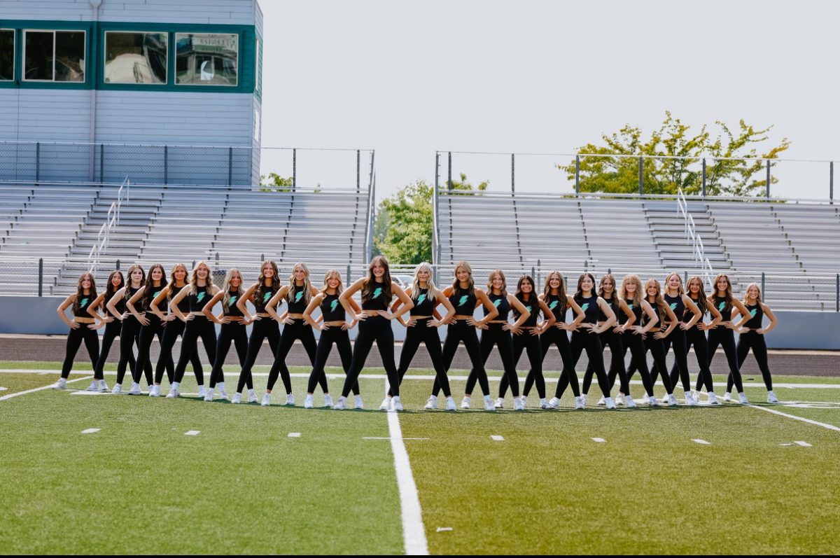 The Eagle High Lighting dance team pose for a photo. The team dances for many sporting events at Eagle High as well as competitions. While many people consider art a sport, some say that dance is art. 