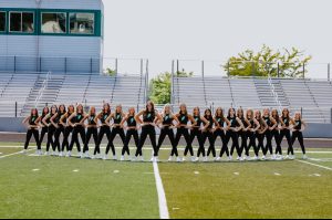 The Eagle High Lighting dance team pose for a photo. The team dances for many sporting events at Eagle High as well as competitions. While many people consider art a sport, some say that dance is art. 