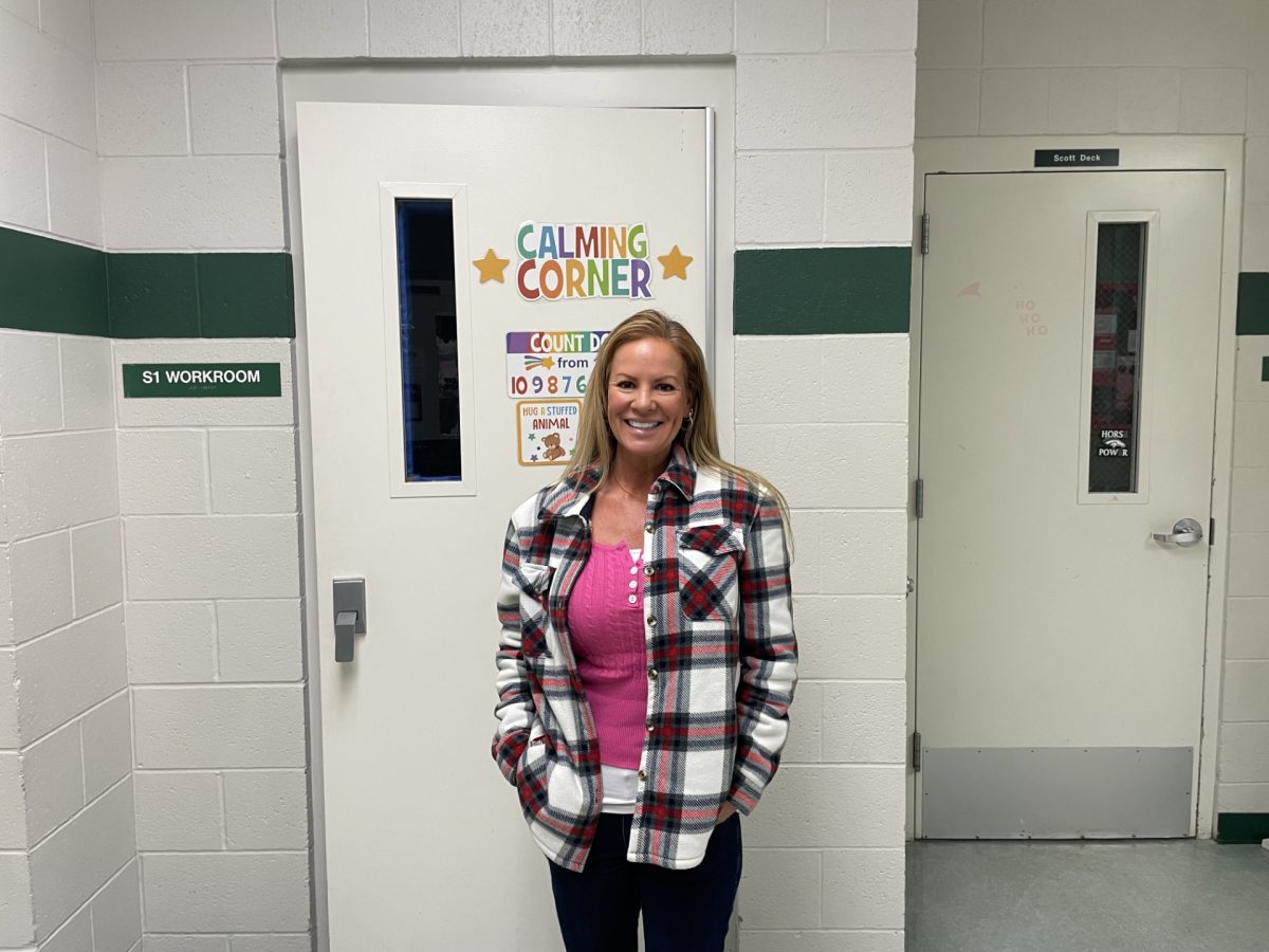 Teacher Virginia Grund stands by the calming room in the South Hall. She strives to make an impact on every student that steps foot into her class. She works with many special needs students and has for 9 years.  