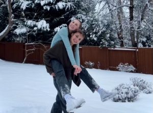 Junior Lola Kristine and sophomore Sophia Hill both love it when school is canceled due to snow. They spend quality time together enjoying the outdoors.