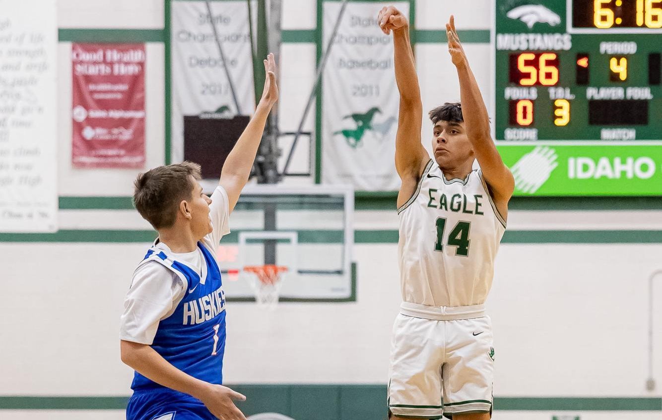 Sophomore Brandon Wheelan (right) scores a point in the boy’s varsity game against Emmet High. 