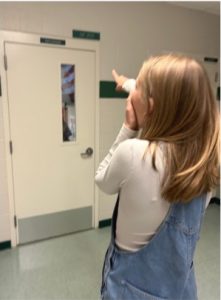 Junior Isabelle Bodily excitedly points out the room where a Graphic Design 3 class will be coming to Eagle High next year. The class is taught by teacher Taylor Damon.