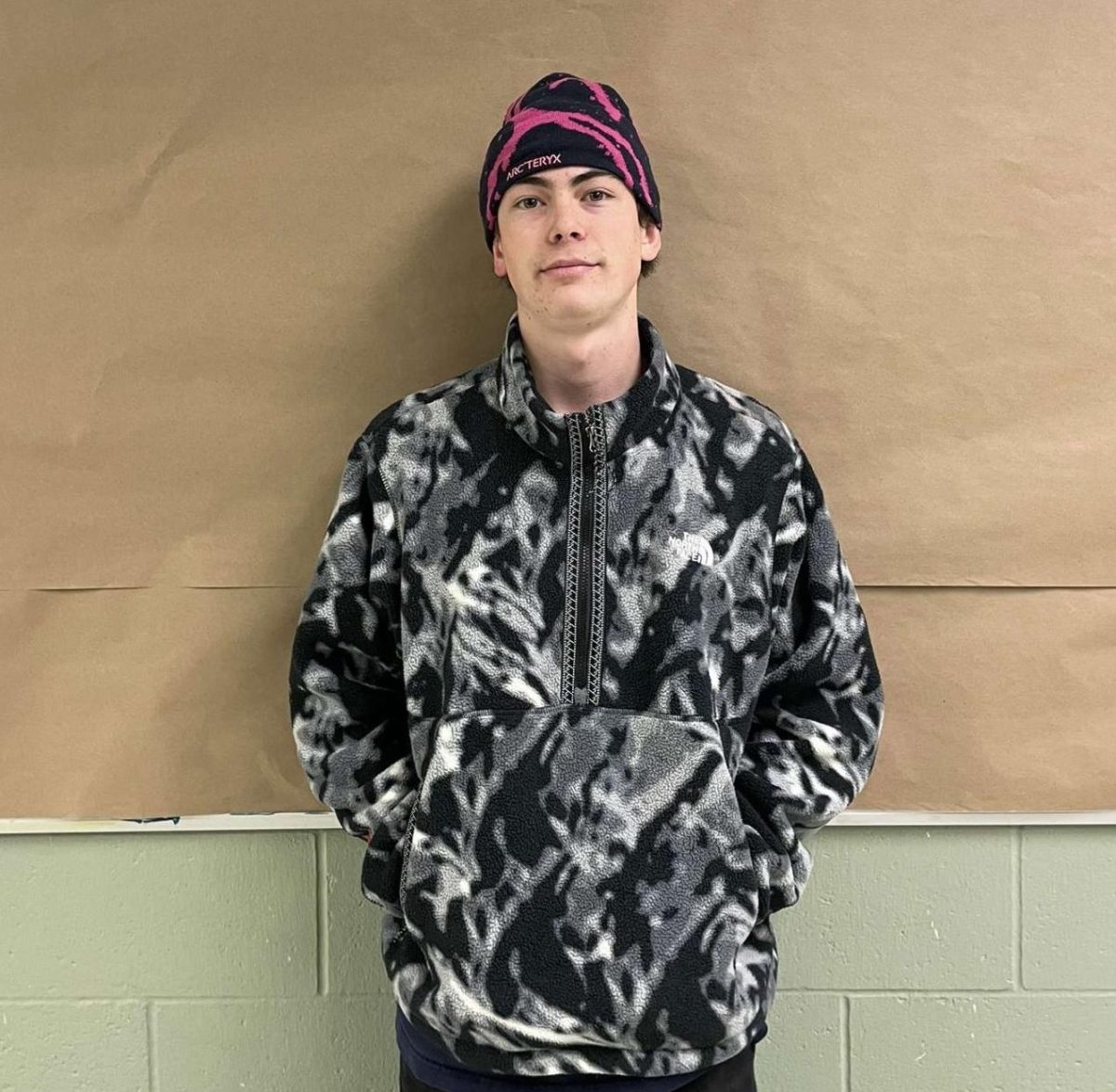 Junior Lucas Reese shows his outfit for the day. He wears a beanie and a jacket for a cold, snowy January morning.