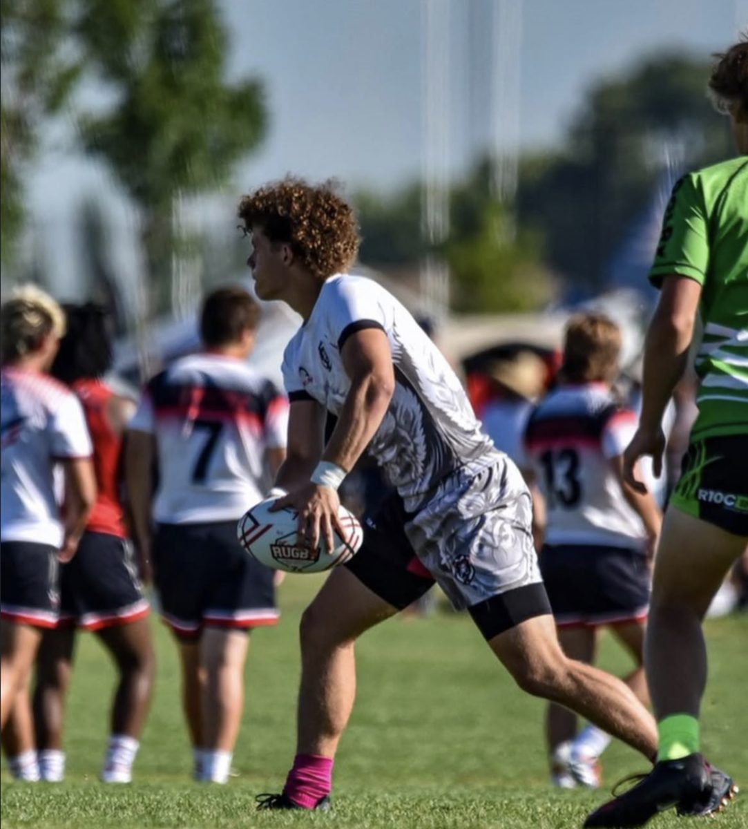 Senior Gavin Crawford, a captain and veteran of the Eagle High rugby team, gets warmed up for at the NAIs. Crawford is committed to play rugby at Central Washington University.