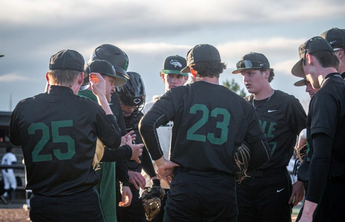 Head varsity baseball coach Scott Deck talks to his team before they play their game at Rocky Mountain High. Eagle High fell short to Rocky Mountain High in extra innings, with a score of 3-2. 