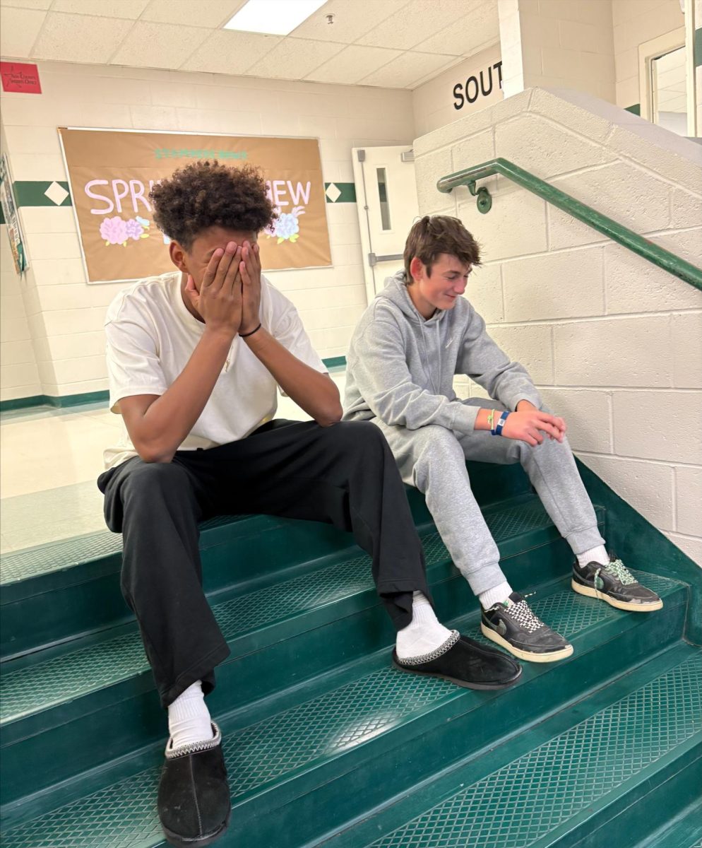 Freshman Aiden Kindrick and freshman Beau Hales sit and laugh on the stairs during the advisory period. They both worked hard to get out of advisory for the fourth quarter to enjoy a longer lunch. 