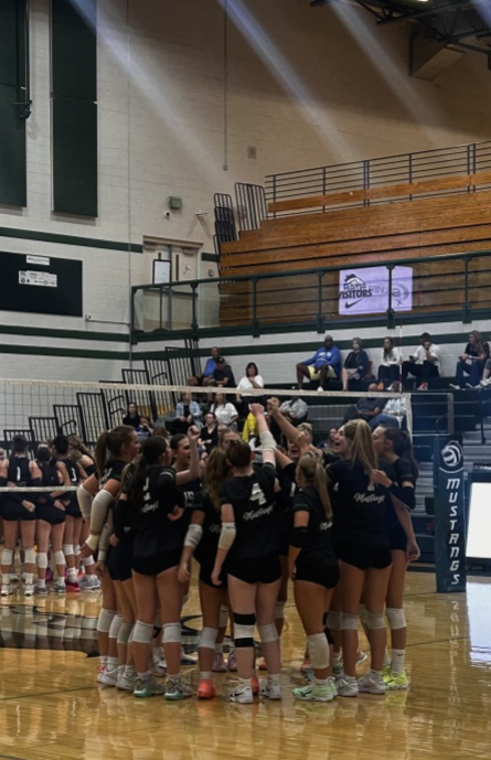  The Eagle High girls’ varsity volleyball team joins together in a final cheer before their game against Timberline High, showing sportsmanship for their fellow athletes. They lost in a close game that ended 2-3. 