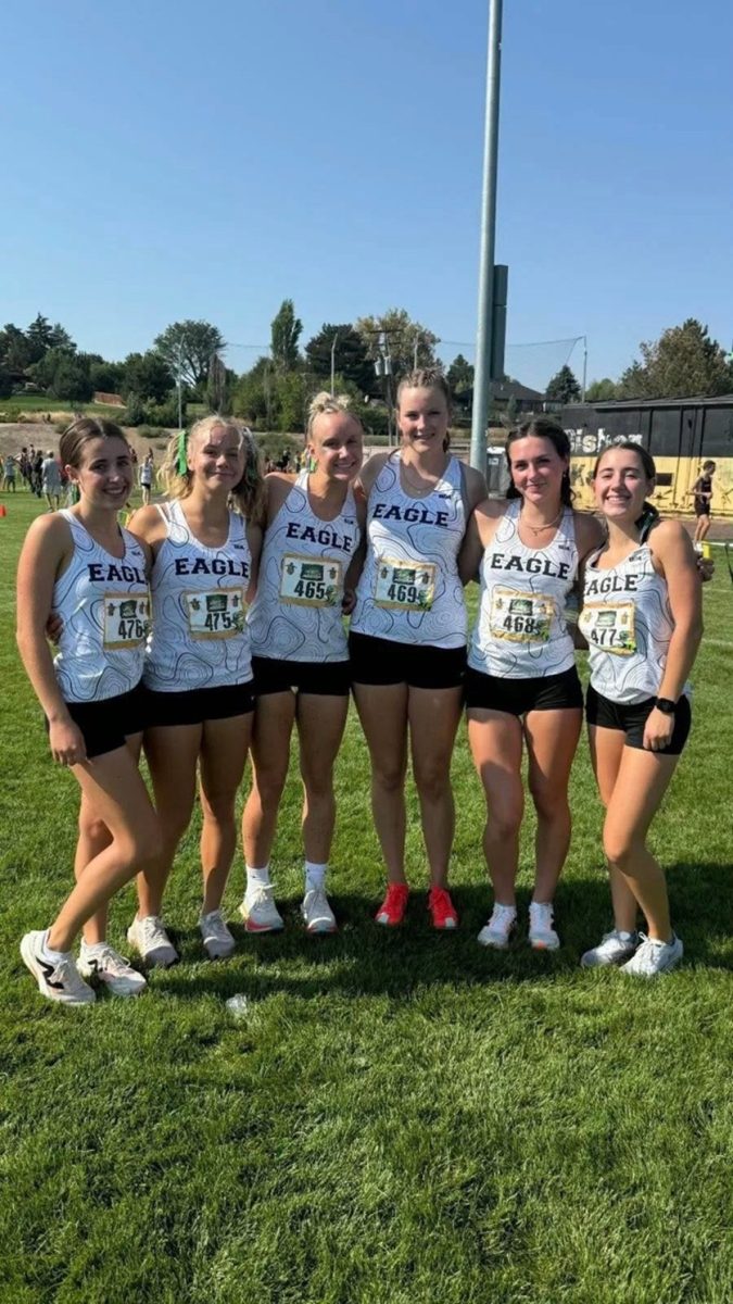 The Eagle High cross country team had their first meet on Aug. 30. It took place at Bishop Kelly High. Senior Andie Roy, junior Betsy Reeder and seniors Lucy Hansen, Anna Glen and Josie Roy all had high spirits after their performance at the race. 