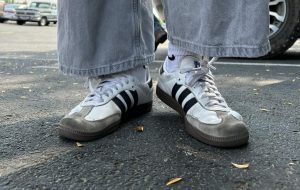 Junior Charlotte Viola wears her white Sambas. Her Sambas show her personal style.