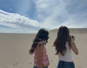 Senior Anna Glen and Senior Maddy Kotter take photos at Bruneau Dunes State Park. Going to the sand dunes during summer is a fun activity to do when the temperature isn't too high but the sun is out.