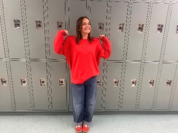 Junior Lauren Skeesuck shows her thrifted sweatshirt and jeans. She found them at the local youth ranch, one of her favorite spots to thrift with friends. 
