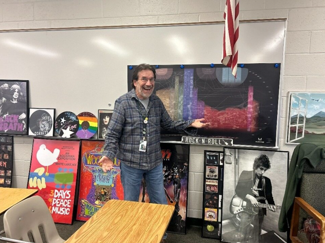 Teacher Mike Corbett not only is a well-loved teacher of History of Rock and Roll, but he also flies planes in his free time.