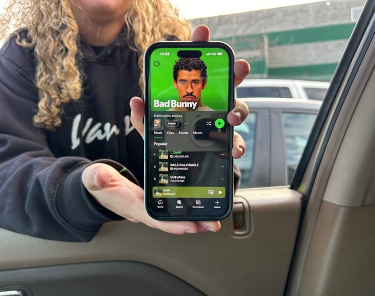  Senior Lucy Palace displays Bad Bunny on Spotify. Controversies over the popular music artist playing at the Superbowl have been a hot topic of debate.