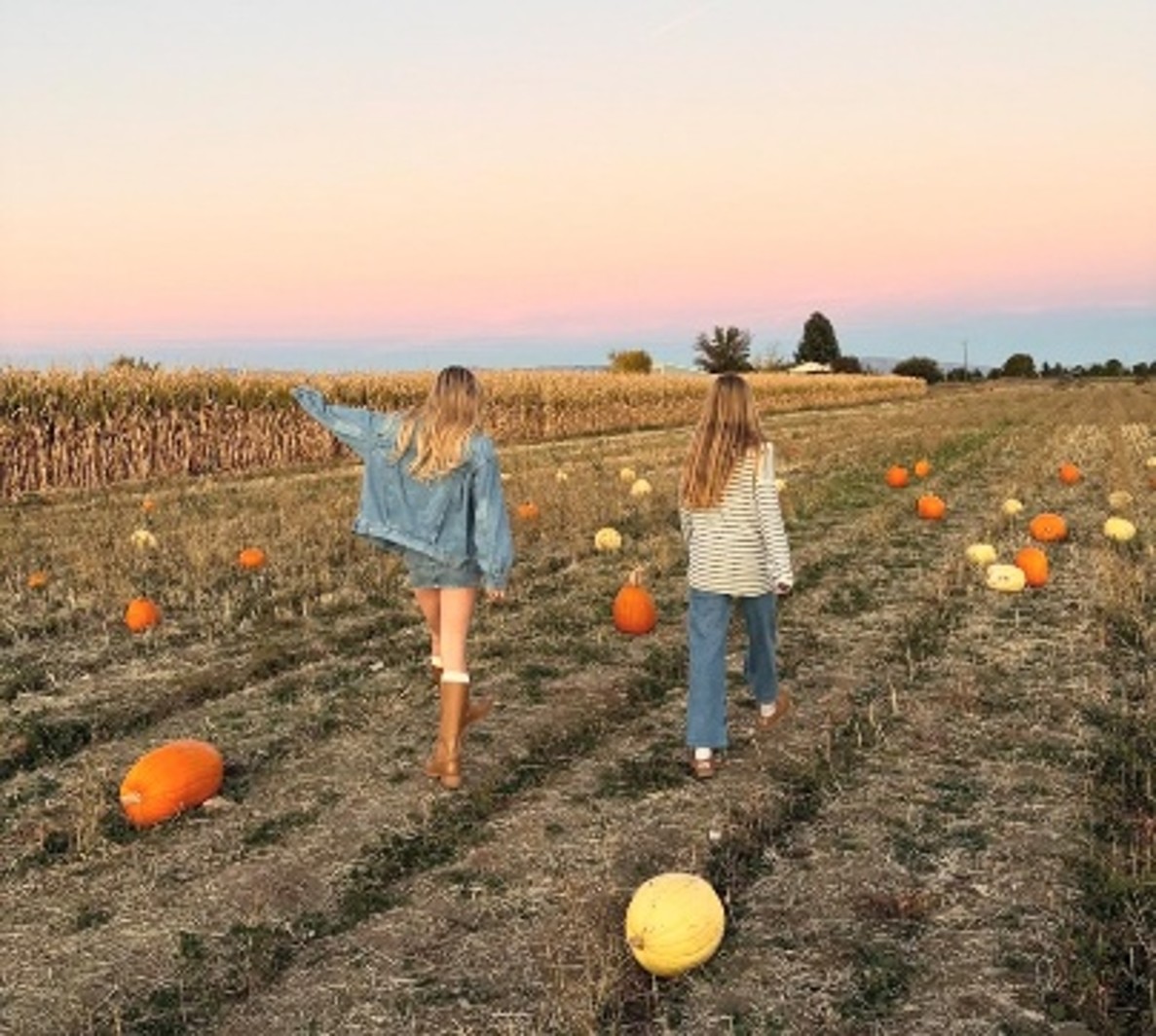 Senior Paige Brown and junior Vienna Perry stroll down a pumpkin patch in perfect autumn weather. As the seasons get colder, Thanksgiving and Christmas approach.