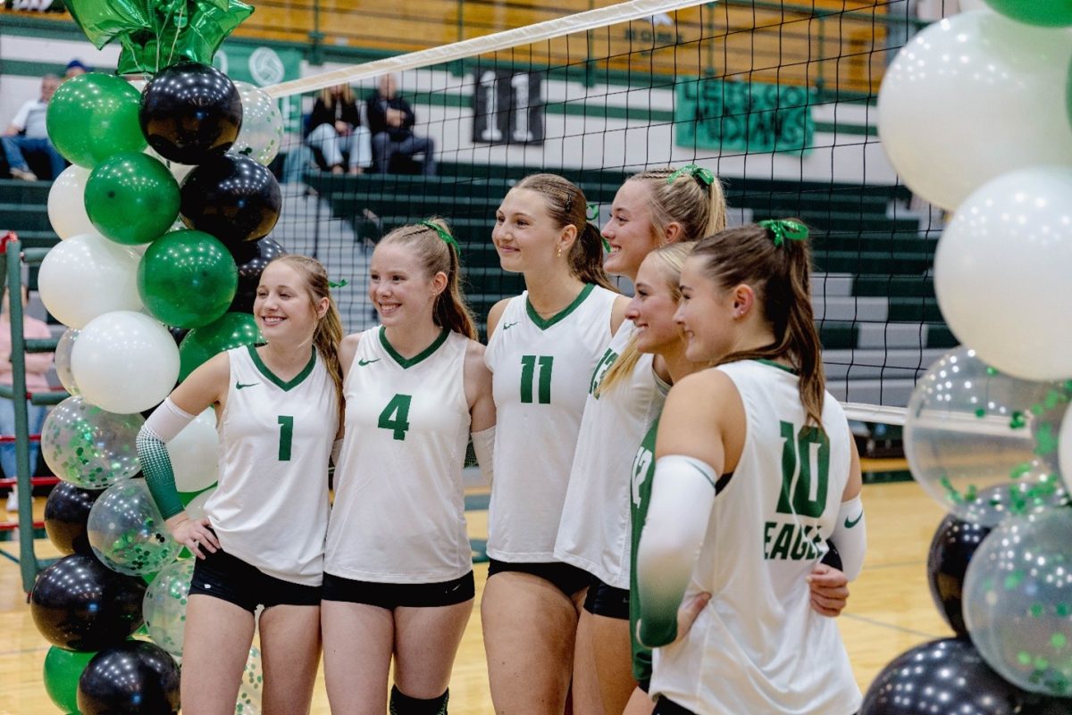 Madi Ruport, Belle Emerson, Maddy Jones, Sophie Giles, Ellie McManigal and Bailey Kluksdal get ready to wrap up their last season as seniors. They look forward to the State tournament with smiles and hope to get top five.