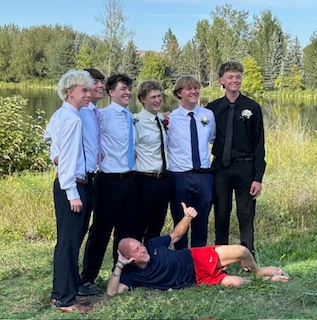 Junior Joey Kelly took photos in his friend’s backyard to kick off the start of Homecoming. He was glad he was able to take a break from schoolwork to have fun night that included dinner and bowling.  