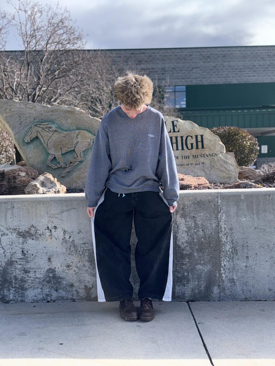 Sophomore Jax Critchfield shows off his swaggy surf style for the flash of the camera. Critchfield is one of many who share this unique style in the Eagle High community. 