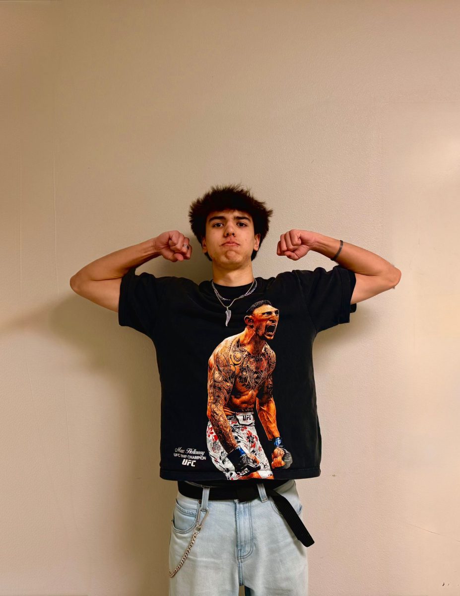 Sophomore Zachary Coates wears a Max Holloway shirt, who is a UFC. fighter. On Jan 24, fighters Justin Gaethje and Patty Pimblett will fight for the first event.  