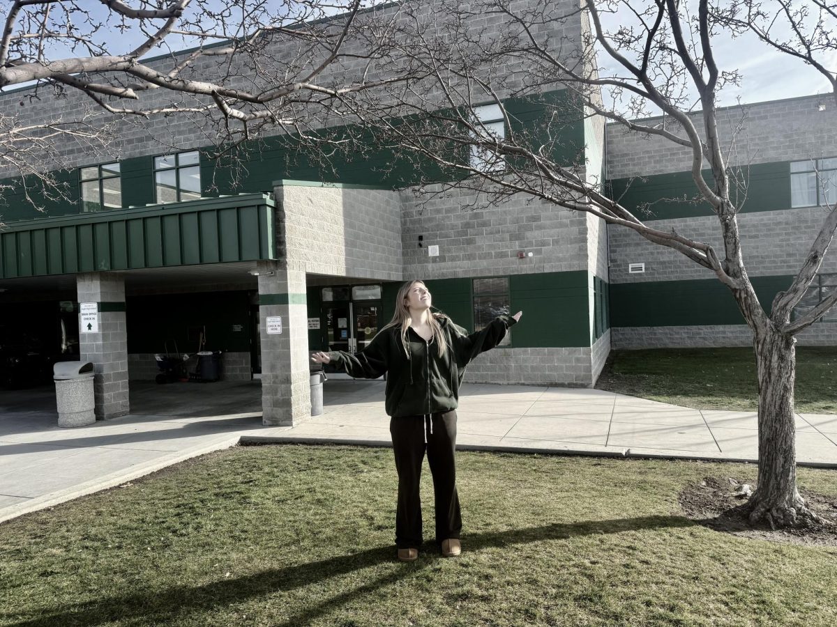 Junior Nicola Forbess stands outside in Eagle’s snowless winter. Many students enjoy not having snow, as snow makes it hard for them to drive. But many students wish for snow so they can go snowboarding and participate in other winter activities.