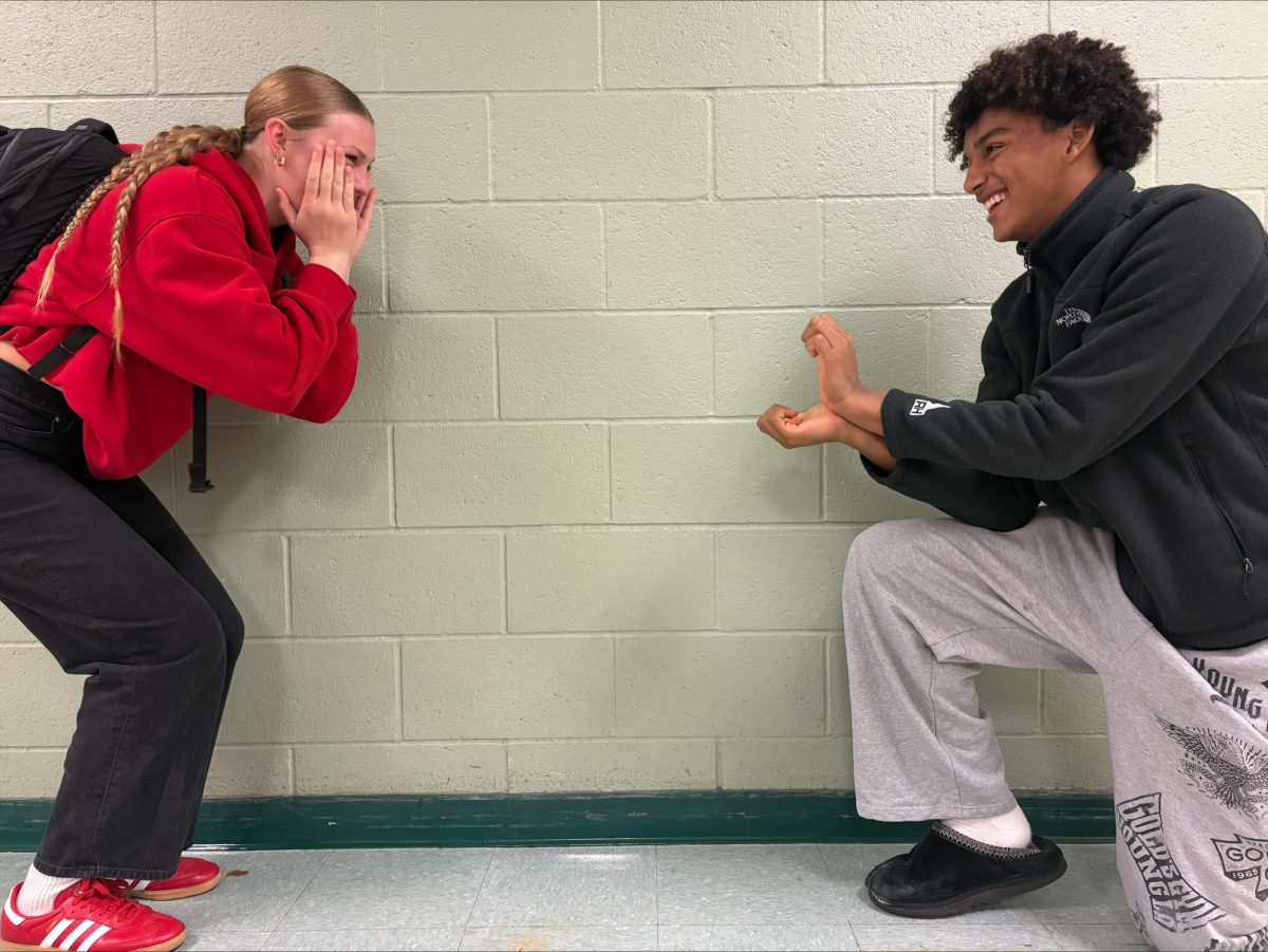 Junior Isabelle Elitharp and sophomore Aiden Kendrick reenact a common scene shown in all romance movies. A proposal at the end of the movie is often how a rom-com wraps up.