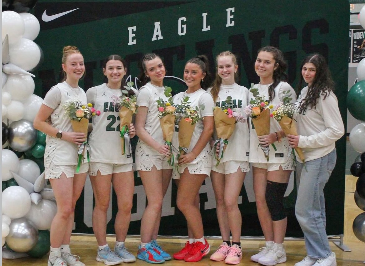 The senior players on the Eagle High girls’ team are celebrated during senior night. The backbone of the Eagle High women's basketball team are their beloved senior players. Seniors Audrey Baxter, Trinity Holsinger, Abbie Lamm, Bella Thompson. Sophie Hosac, Peyton Taylor and Sofia Younes take a picture that will hold memories for years to come.